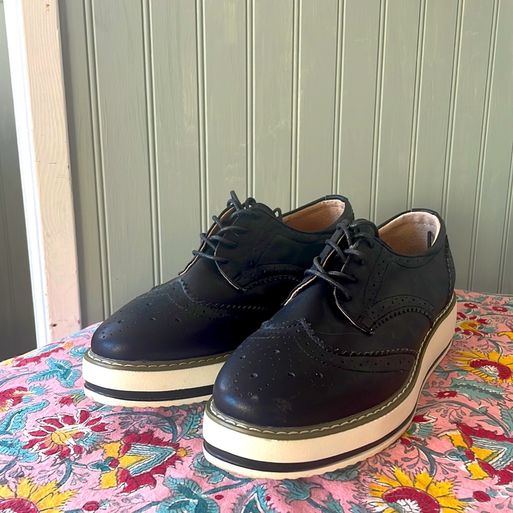 Black wingtip platform shoes